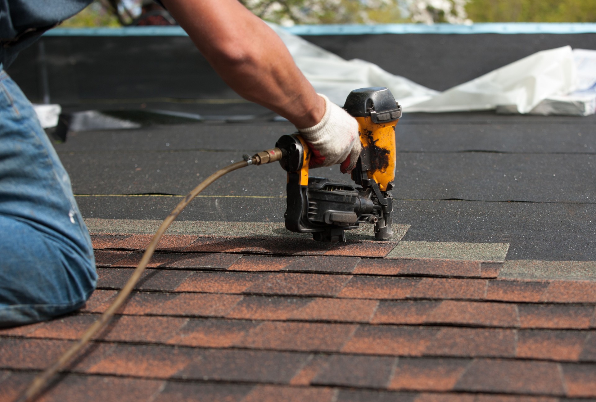 roofers installing new roof on house